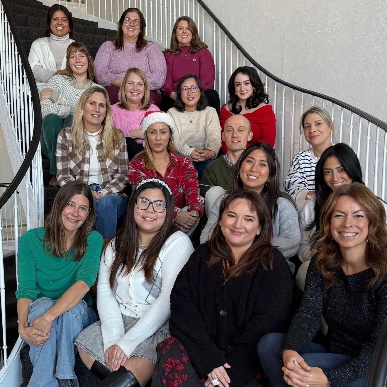 The Innovative Counseling Partners team gathered on a staircase